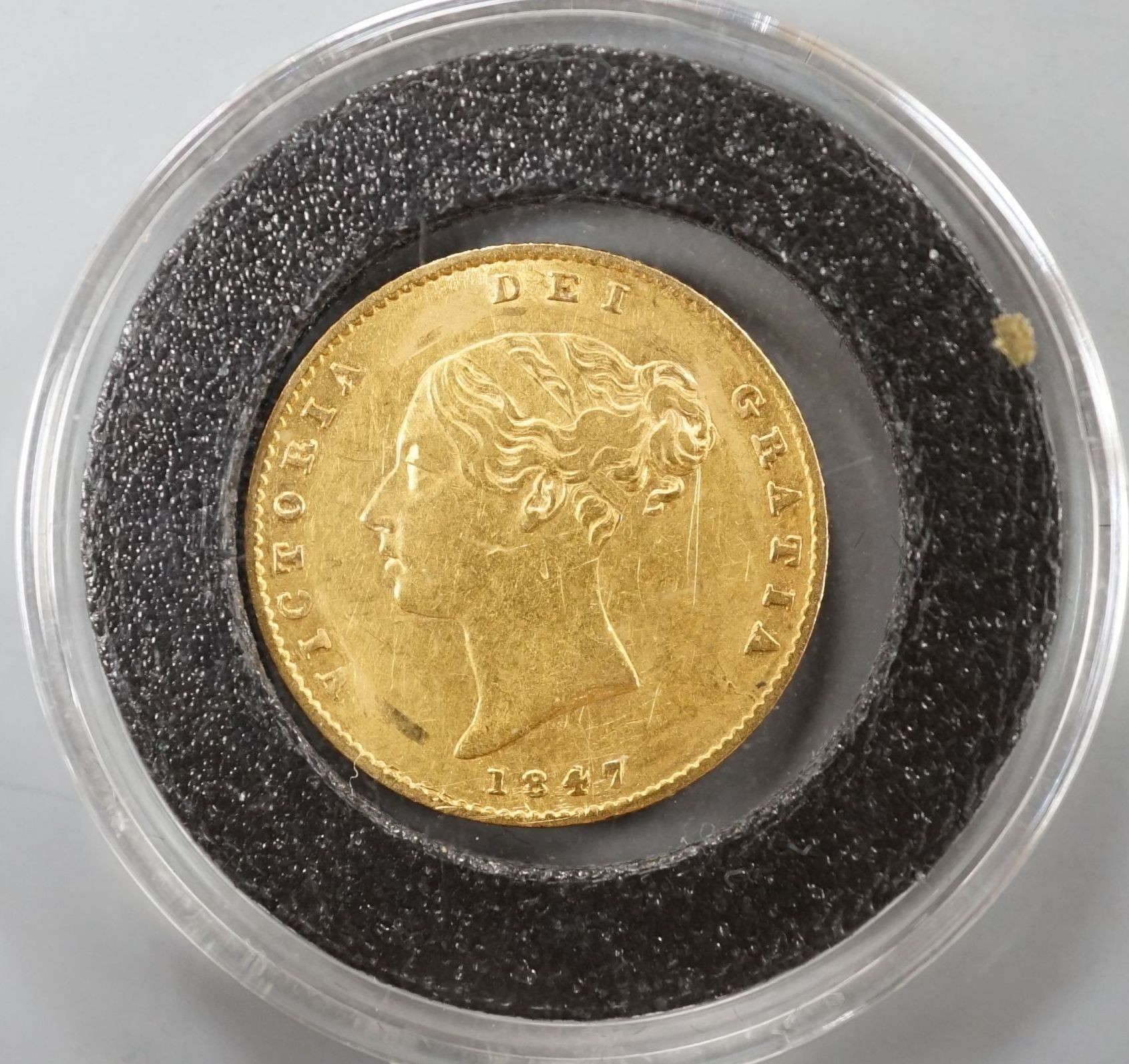 An 1842 gold half sovereign, mount marks otherwise good F.